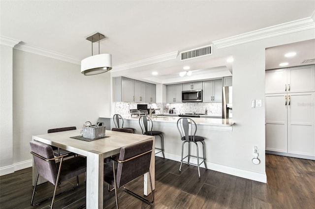400 Island Way Unit 502, Clearwater Beach, FL 33767 - dining area with crown molding, dark wood-style flooring, and recessed lighting