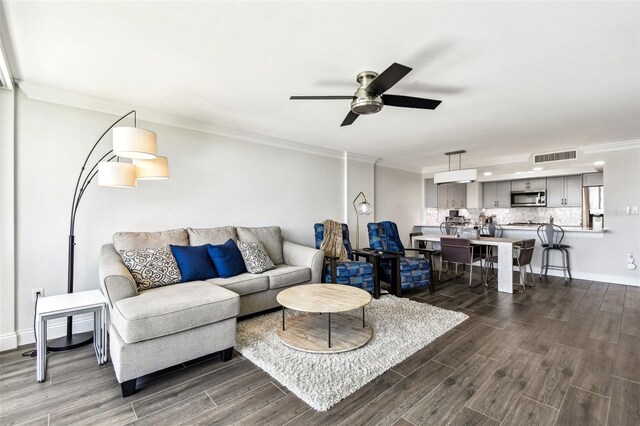 400 Island Way Unit 502, Clearwater Beach, FL 33767 - living area featuring dark wood-style floors, a ceiling fan, and ornamental molding