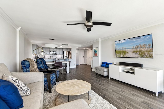 400 Island Way Unit 502, Clearwater Beach, FL 33767 - living area with wood finish floors, ceiling fan, and crown molding