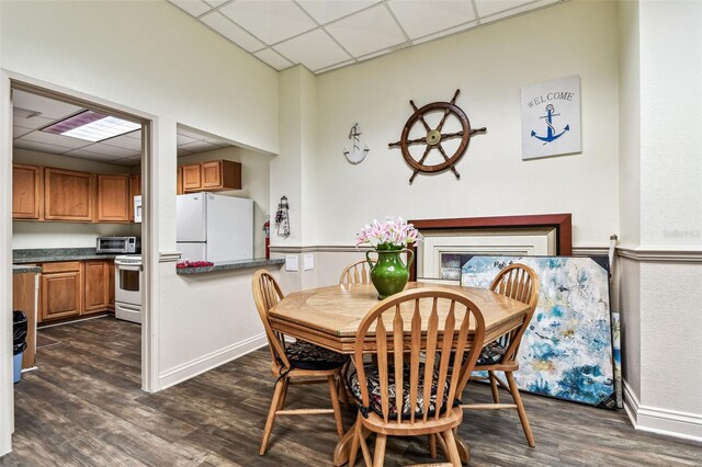 400 Island Way Unit 502, Clearwater Beach, FL 33767 - dining area featuring a drop ceiling and dark wood-type flooring