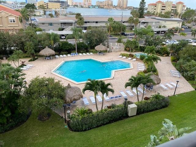 400 Island Way Unit 502, Clearwater Beach, FL 33767 - community pool featuring a yard, a patio area, and a view of city