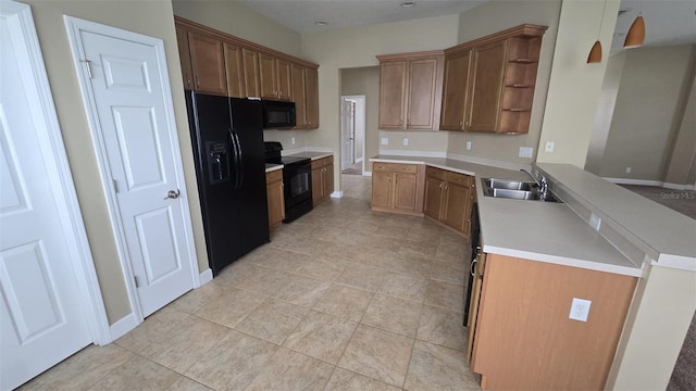 11341 Durham St, Parrish, FL 34219 - kitchen featuring black appliances, open shelves, a peninsula, light tile patterned floors, and light countertops