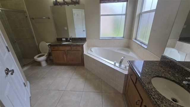 11341 Durham St, Parrish, FL 34219 - bathroom with two vanities, a stall shower, tile patterned floors, and a garden tub
