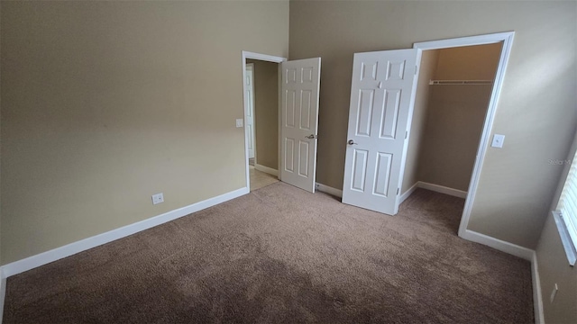 11341 Durham St, Parrish, FL 34219 - unfurnished bedroom featuring carpet floors, a closet, a spacious closet, and a high ceiling
