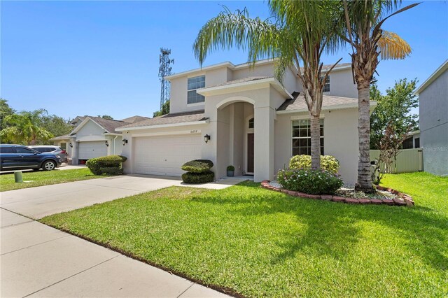 10216 Summer Azure Dr, Riverview, FL 33578 - view of front of house with stucco siding, concrete driveway, an attached garage, and roof with shingles