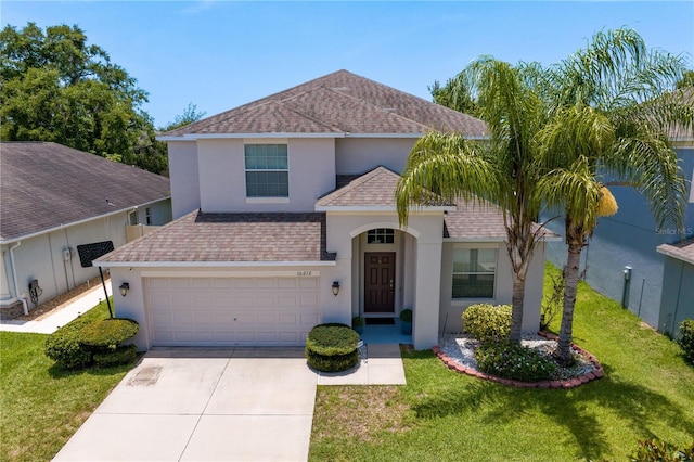 10216 Summer Azure Dr, Riverview, FL 33578 - view of front facade featuring a shingled roof, concrete driveway, stucco siding, and a front lawn
