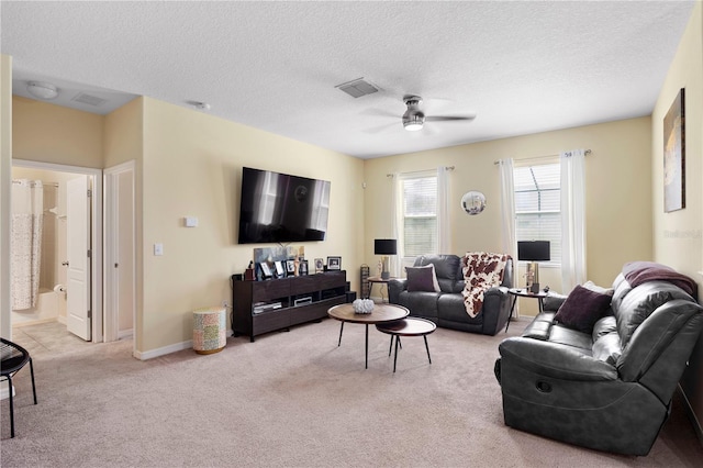 10216 Summer Azure Dr, Riverview, FL 33578 - living area with light colored carpet, ceiling fan, and a textured ceiling