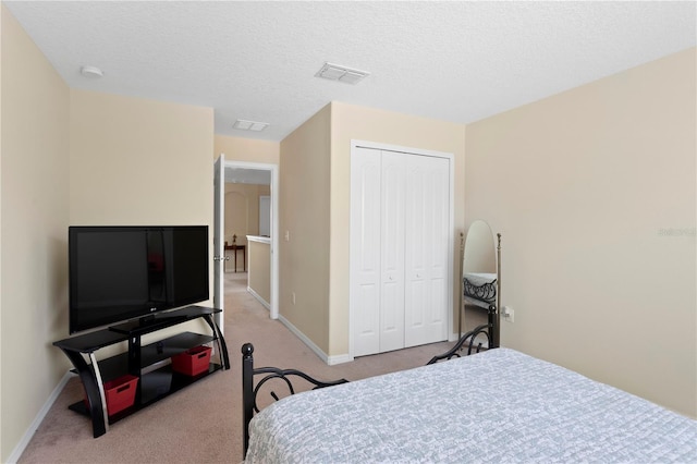 10216 Summer Azure Dr, Riverview, FL 33578 - bedroom with a closet, light carpet, and a textured ceiling