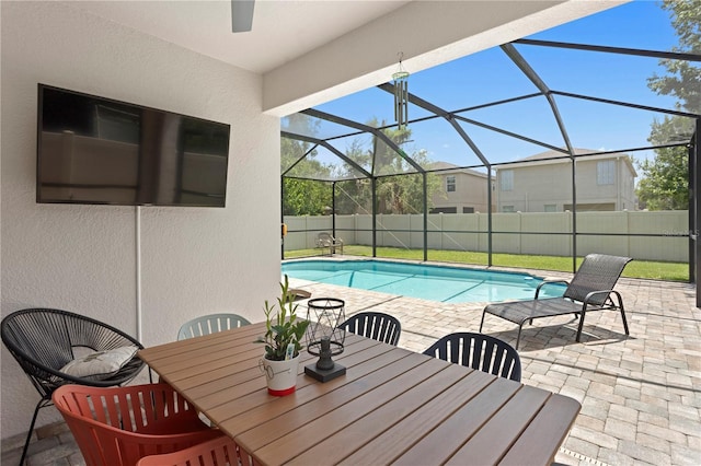 10216 Summer Azure Dr, Riverview, FL 33578 - fenced backyard featuring a patio, glass enclosure, and outdoor dining space