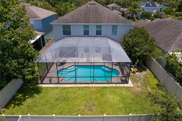 10216 Summer Azure Dr, Riverview, FL 33578 - rear view of property with a fenced backyard, a patio area, roof with shingles, stucco siding, and glass enclosure
