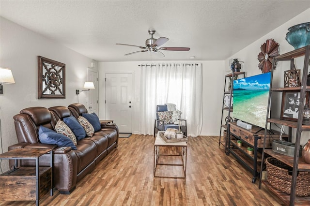 630 Mac Crillus Rd, Largo, FL 33770 - living area with ceiling fan, wood finished floors, and a textured ceiling