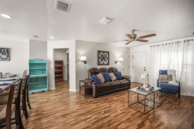 630 Mac Crillus Rd, Largo, FL 33770 - living room featuring a textured ceiling, wood finished floors, ceiling fan, and recessed lighting