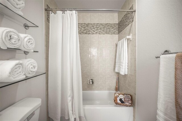 630 Mac Crillus Rd, Largo, FL 33770 - bathroom featuring shower / tub combo with curtain and toilet