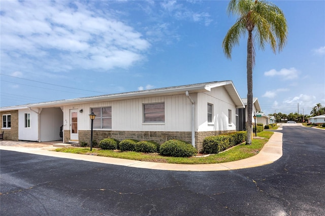 12400 Park Blvd Unit 417, Seminole, FL 33772 - view of front of house featuring stone siding