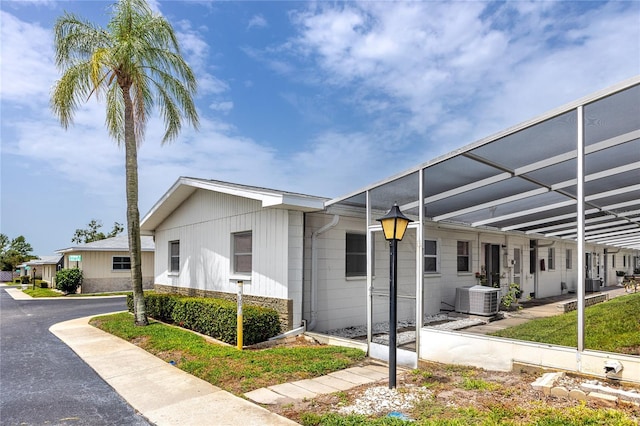 12400 Park Blvd Unit 417, Seminole, FL 33772 - view of front of home featuring stone siding