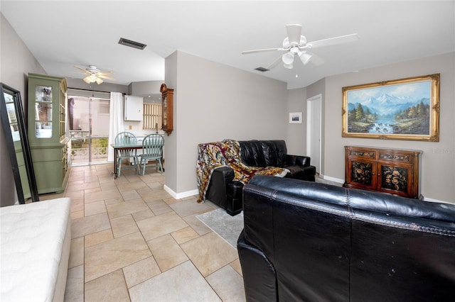 12400 Park Blvd Unit 417, Seminole, FL 33772 - living area featuring a ceiling fan and light stone finish floors