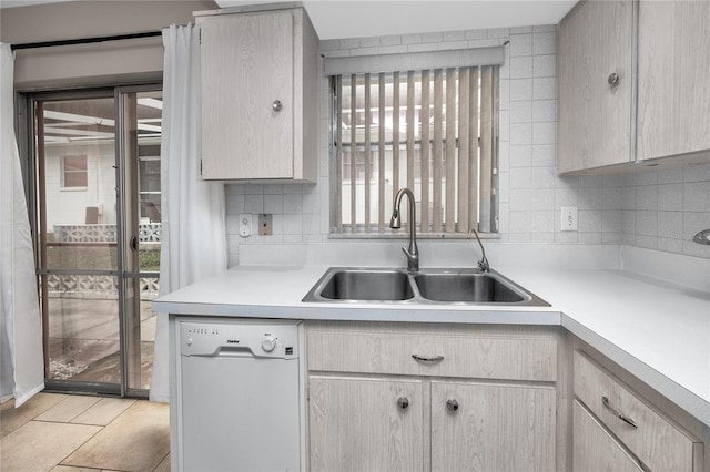 12400 Park Blvd Unit 417, Seminole, FL 33772 - kitchen with dishwasher, light countertops, and tasteful backsplash