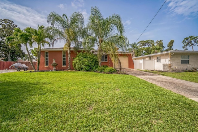 51 Cypress Dr, Palm Harbor, FL 34684 - view of front of house featuring concrete driveway, stucco siding, and a garage