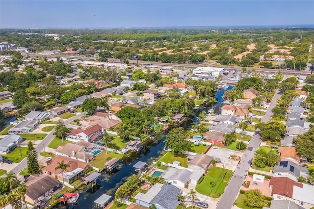 51 Cypress Dr, Palm Harbor, FL 34684 - aerial view of property's location with nearby suburban area and a large body of water