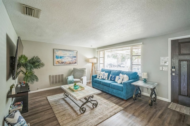51 Cypress Dr, Palm Harbor, FL 34684 - living area with wood finished floors and a textured ceiling