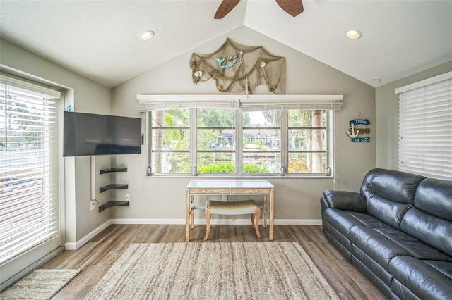 51 Cypress Dr, Palm Harbor, FL 34684 - living area with wood finished floors, a ceiling fan, vaulted ceiling, and recessed lighting