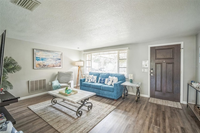 51 Cypress Dr, Palm Harbor, FL 34684 - living area with a textured ceiling and wood finished floors