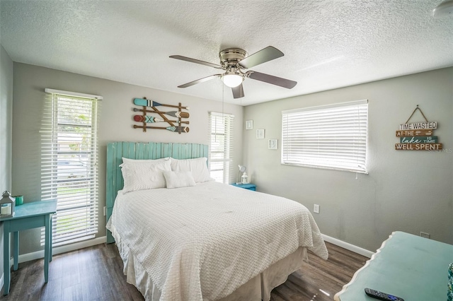 51 Cypress Dr, Palm Harbor, FL 34684 - bedroom featuring wood finished floors, multiple windows, ceiling fan, and a textured ceiling