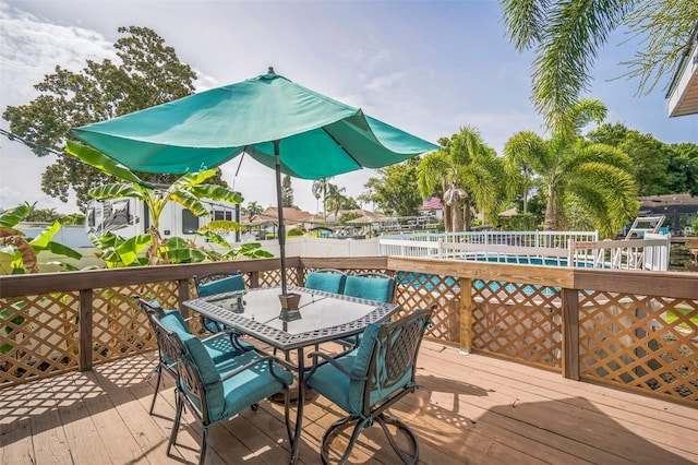 51 Cypress Dr, Palm Harbor, FL 34684 - deck with outdoor dining area