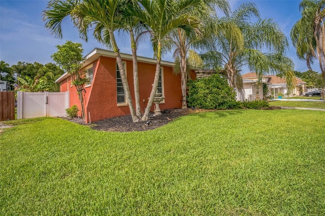 51 Cypress Dr, Palm Harbor, FL 34684 - view of side of home with stucco siding
