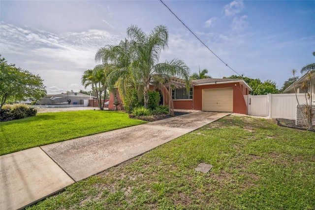 51 Cypress Dr, Palm Harbor, FL 34684 - view of front facade featuring a garage, concrete driveway, and stucco siding