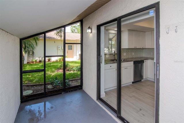 8626 Woodbridge Dr, New Port Richey, FL 34655 - unfurnished sunroom featuring a sink