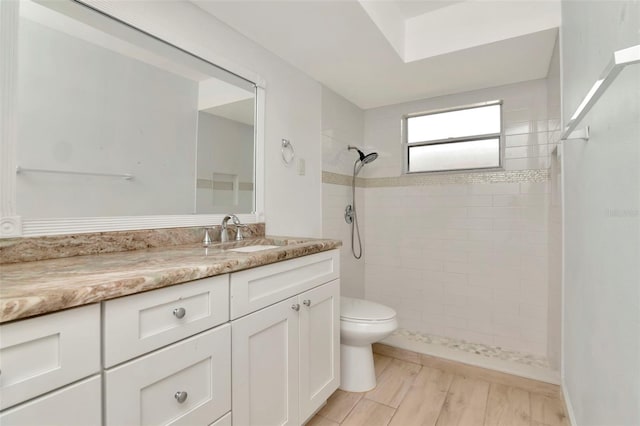 8626 Woodbridge Dr, New Port Richey, FL 34655 - bathroom featuring a tile shower and vanity