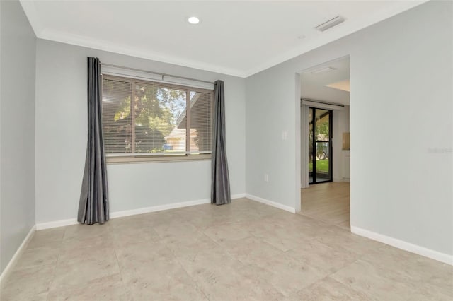 8626 Woodbridge Dr, New Port Richey, FL 34655 - spare room featuring crown molding and light tile patterned flooring