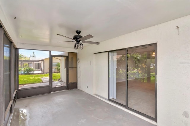 8626 Woodbridge Dr, New Port Richey, FL 34655 - unfurnished sunroom with a ceiling fan