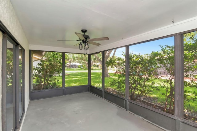 8626 Woodbridge Dr, New Port Richey, FL 34655 - unfurnished sunroom featuring ceiling fan