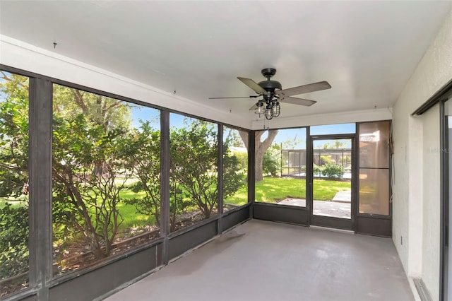8626 Woodbridge Dr, New Port Richey, FL 34655 - unfurnished sunroom featuring a ceiling fan