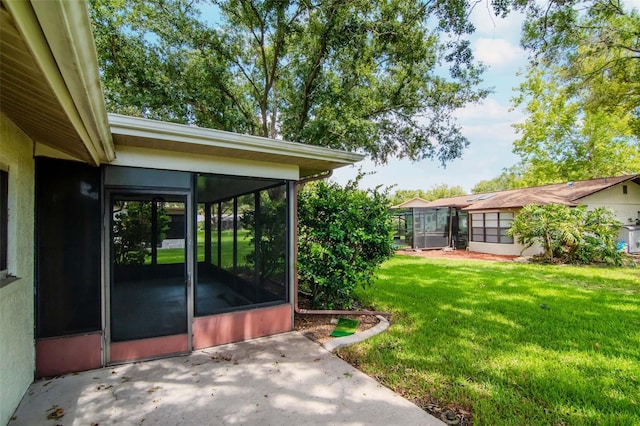 8626 Woodbridge Dr, New Port Richey, FL 34655 - view of green lawn with a sunroom