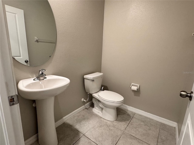 4448 Globe Thistle, Tampa, FL 33619 - half bath with tile patterned floors