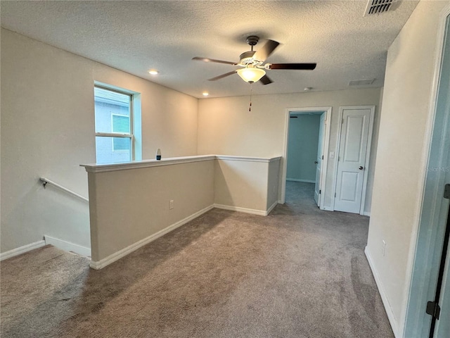 4448 Globe Thistle, Tampa, FL 33619 - carpeted empty room featuring a textured ceiling and a ceiling fan