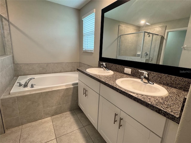 4448 Globe Thistle, Tampa, FL 33619 - full bathroom featuring a garden tub, a shower stall, double vanity, and tile patterned floors