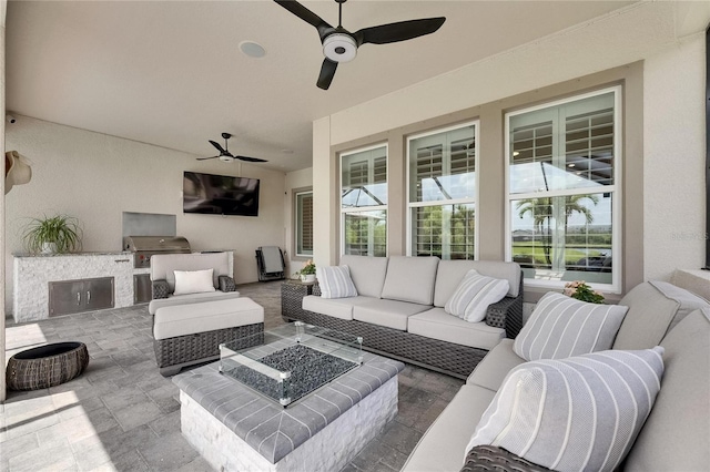 7420 Paradiso Dr, Apollo Beach, FL 33572 - view of patio featuring area for grilling, an outdoor living space with a fire pit, and a ceiling fan