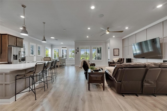 7420 Paradiso Dr, Apollo Beach, FL 33572 - living room with ornamental molding, light wood-style floors, recessed lighting, and a ceiling fan