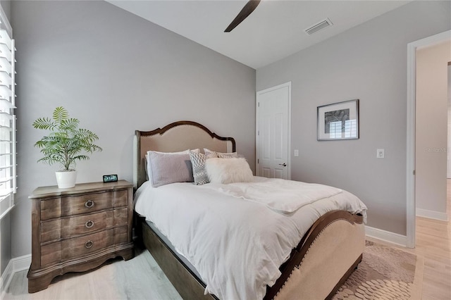 7420 Paradiso Dr, Apollo Beach, FL 33572 - bedroom with light wood-style flooring, a ceiling fan, and vaulted ceiling