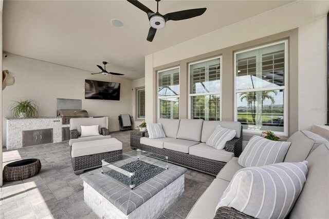 7420 Paradiso Dr, Apollo Beach, FL 33572 - view of patio / terrace with an outdoor kitchen, an outdoor living space with a fire pit, and a ceiling fan