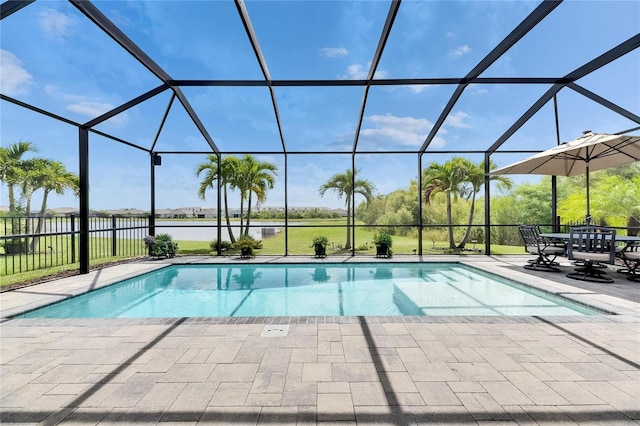 7420 Paradiso Dr, Apollo Beach, FL 33572 - outdoor pool featuring a patio, a water view, and glass enclosure
