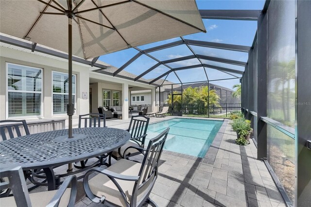 7420 Paradiso Dr, Apollo Beach, FL 33572 - view of swimming pool with an outdoor living space, a patio, glass enclosure, and outdoor dining space