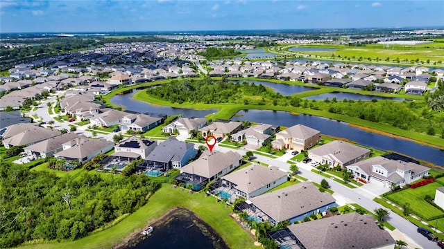 7420 Paradiso Dr, Apollo Beach, FL 33572 - aerial view of property and surrounding area featuring nearby suburban area and a nearby body of water