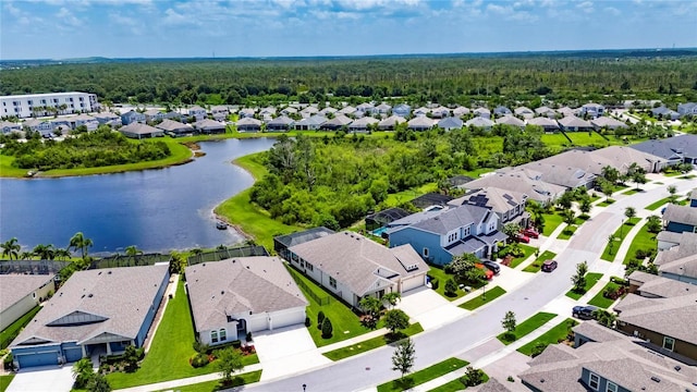 7420 Paradiso Dr, Apollo Beach, FL 33572 - aerial view of residential area featuring a heavily wooded area and a large body of water