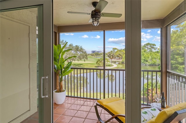 2400 Feather Sound Dr Unit 528, Clearwater, FL 33762 - sunroom / solarium with ceiling fan, tile patterned floors, and golf course view