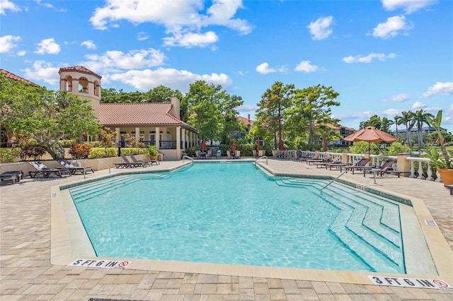 2400 Feather Sound Dr Unit 528, Clearwater, FL 33762 - community pool featuring a patio area